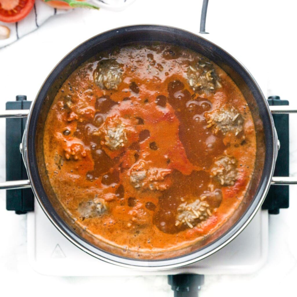 Porcupine Meatballs recipe cooking on stove.