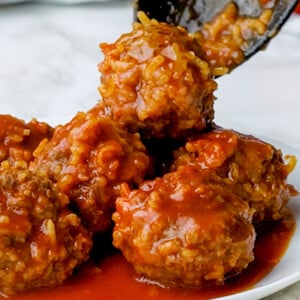 Porcupine Meatballs spooned onto plate.