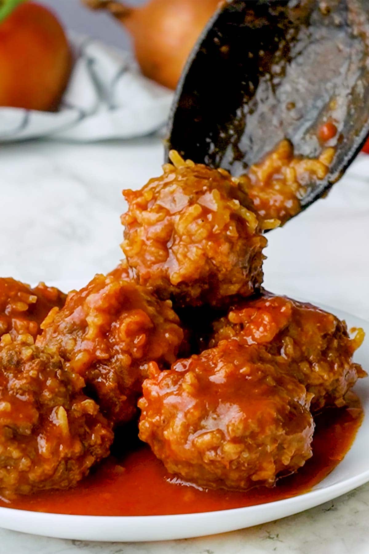 Porcupine Meatballs spooned onto plate.