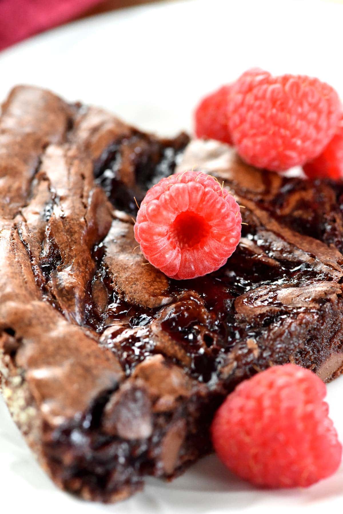 Close-up of raspberry swirl on homemade brownie recipe.