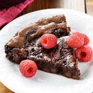 Raspberry Brownies with swirl of jam and berries.