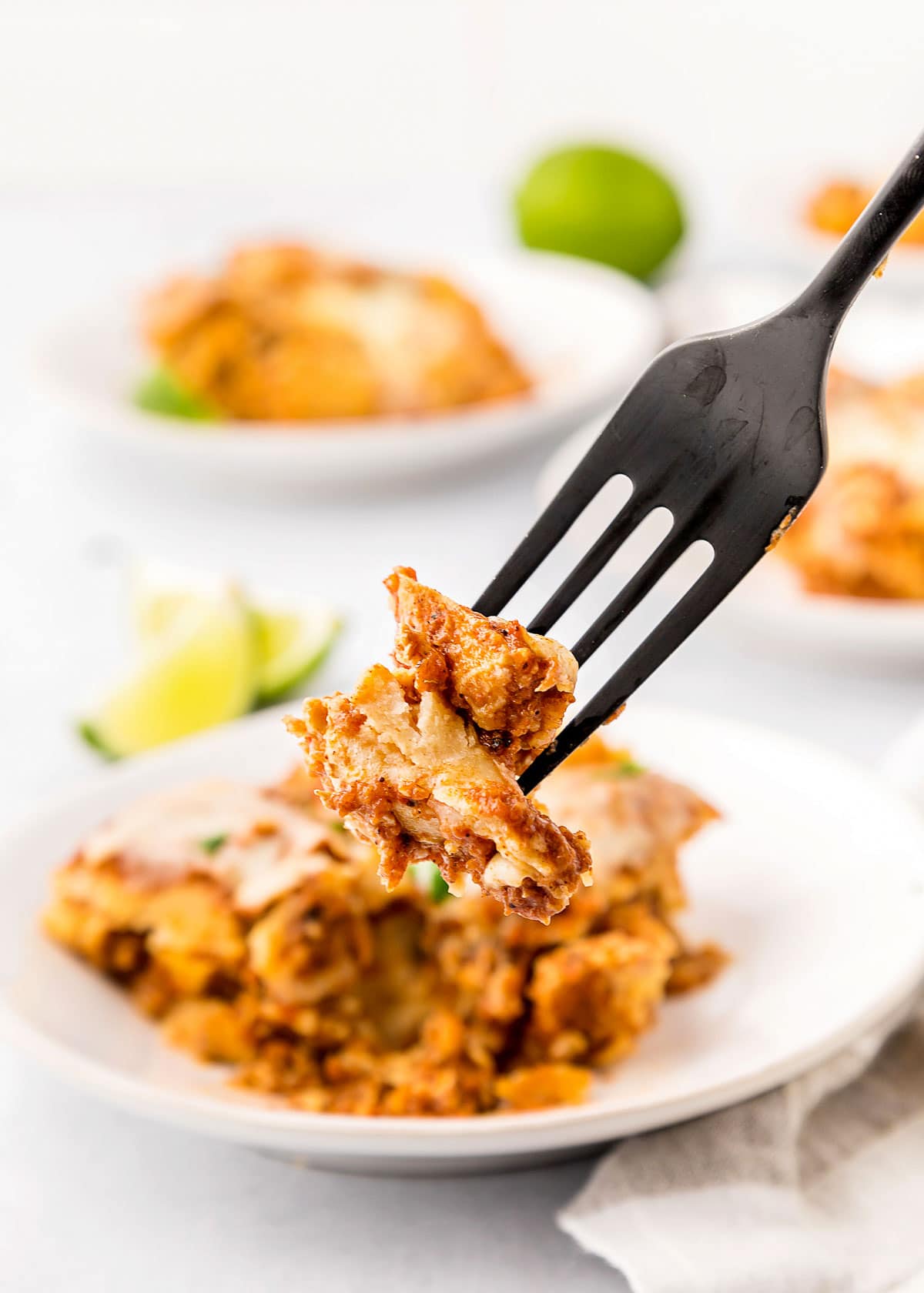 Crock Pot Chicken Enchiladas bite on fork.