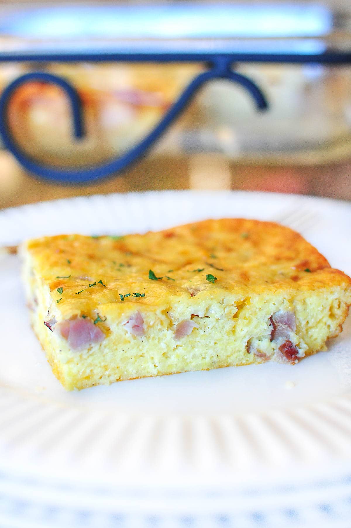 Slice of Grits Casserole on plate.