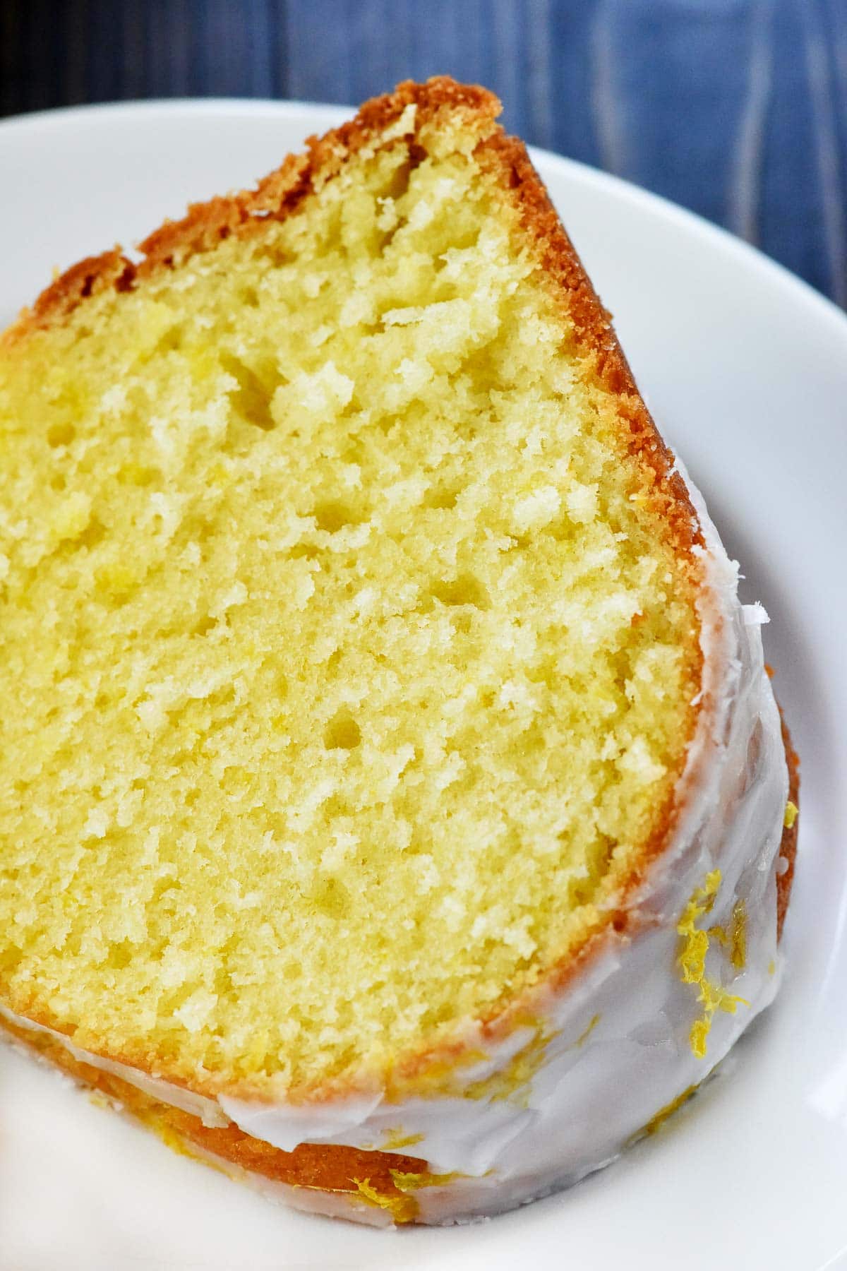 Slice of Lemon Pound Cake on white plate.