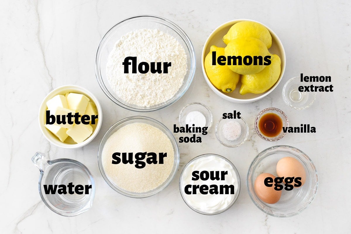 Labeled ingredients to make Lemon Sheet Cake, the best lemon cake recipe.