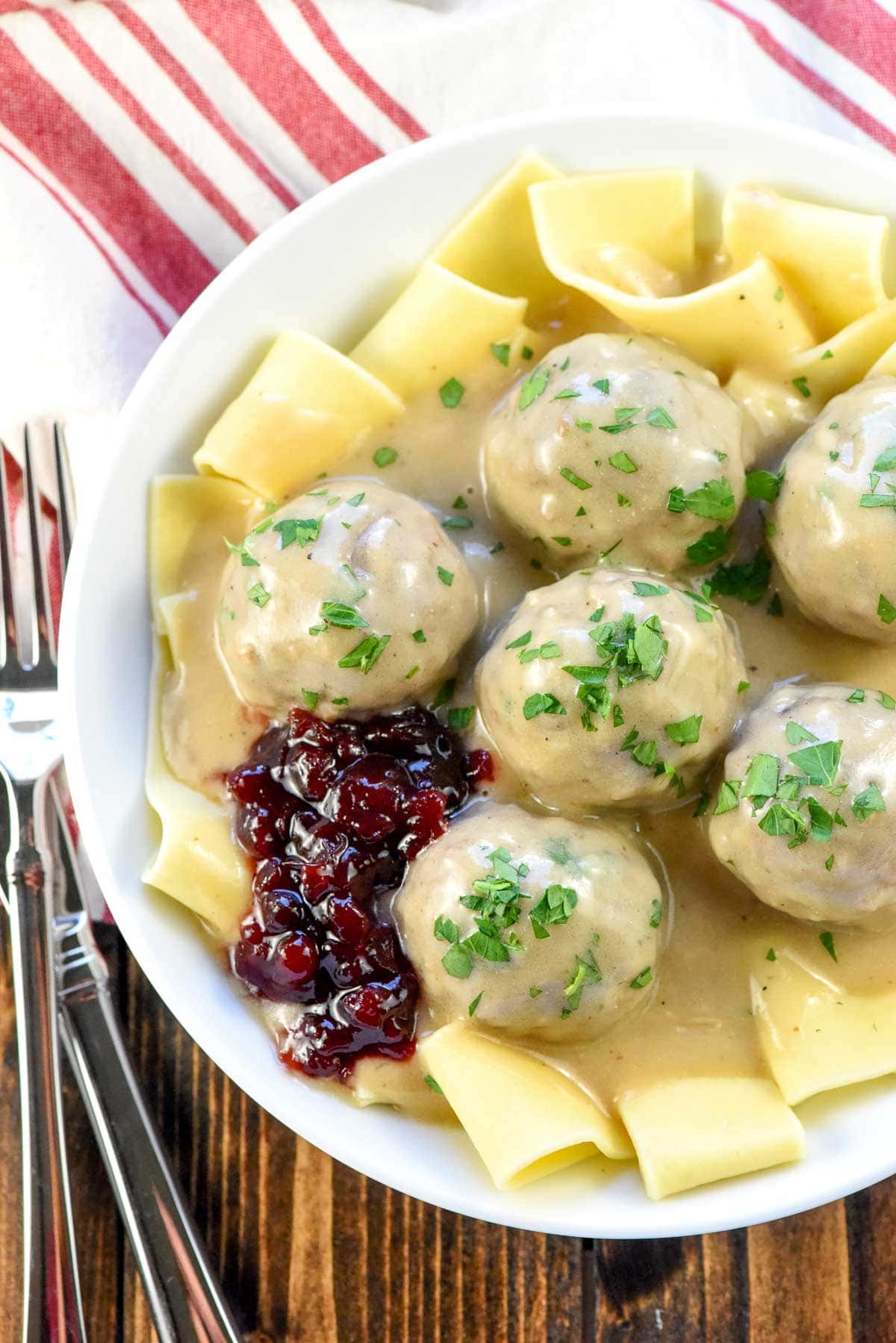 Aerial view of Swedish Meatballs with parsley and lingonberry jam.