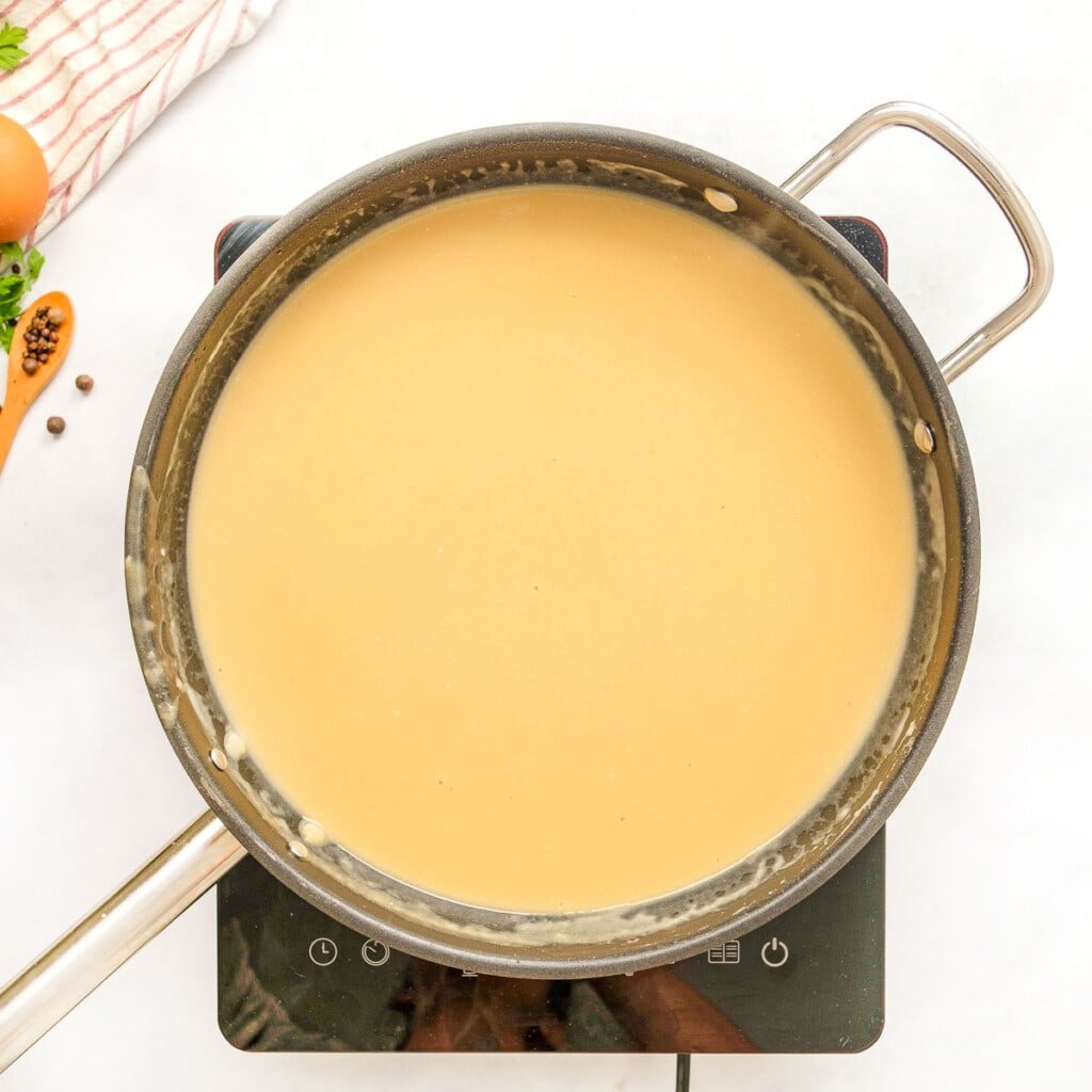 Skillet of finished sauce for easy swedish meatballs recipe.