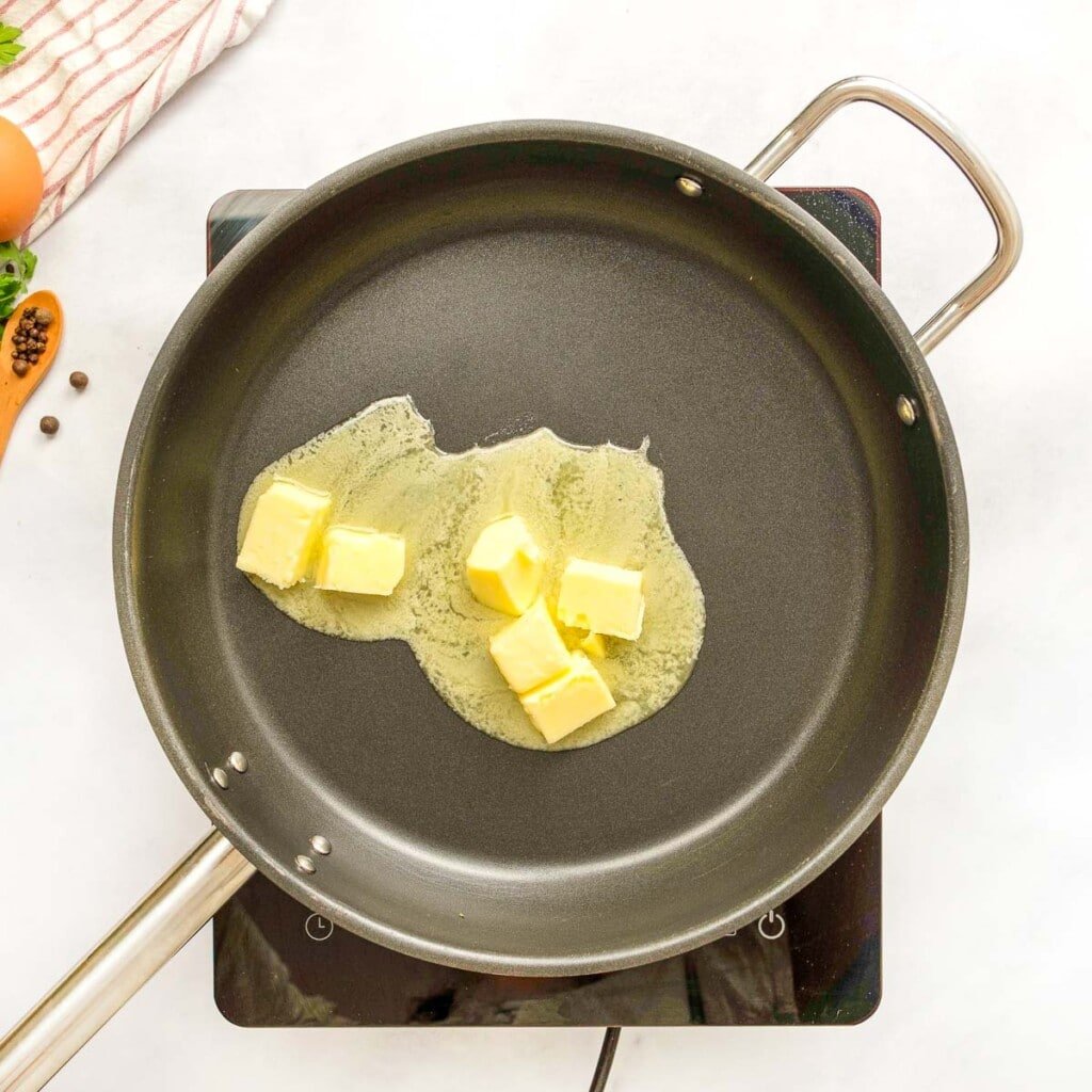 Melting butter in skillet for Swedish meatball sauce.