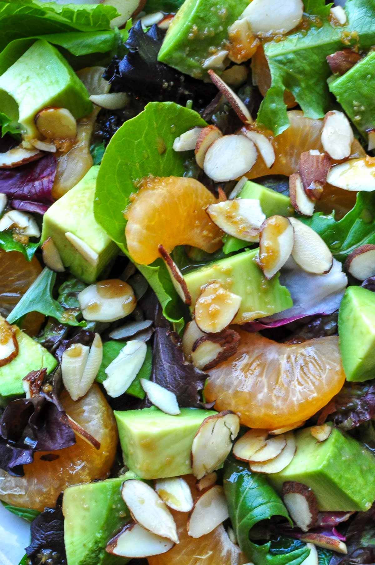 Close-up of sesame ginger vinaigrette drizzled over salad.