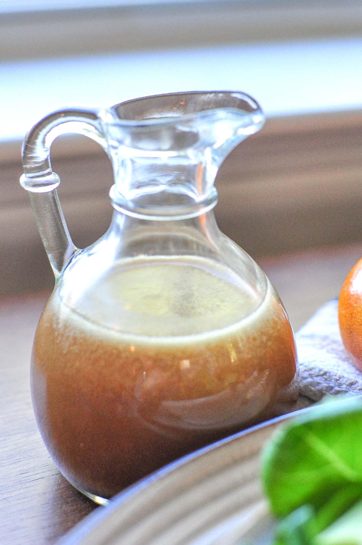 Asian Salad Dressing recipe in glass bottle on table.