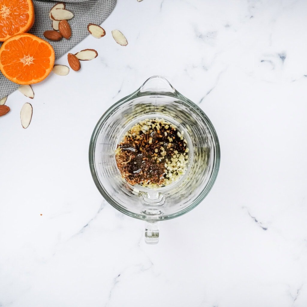 Adding sesame oil to Asian sesame dressing.