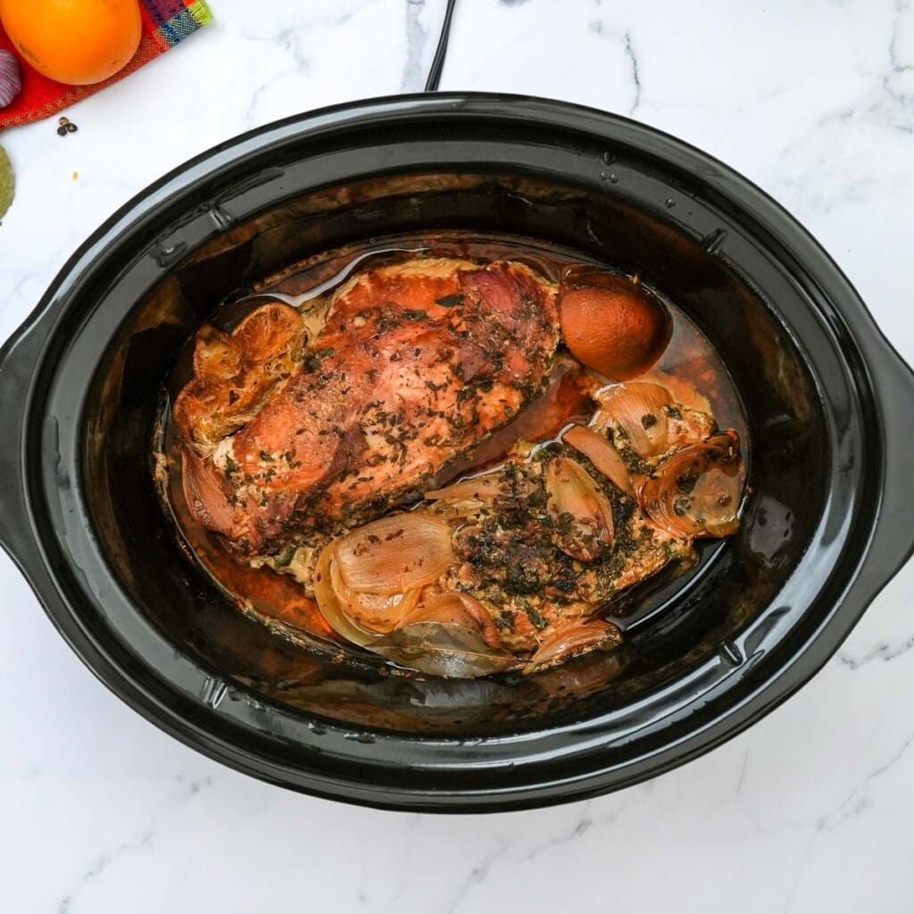 Pork carnitas finished cooking in crock pot.