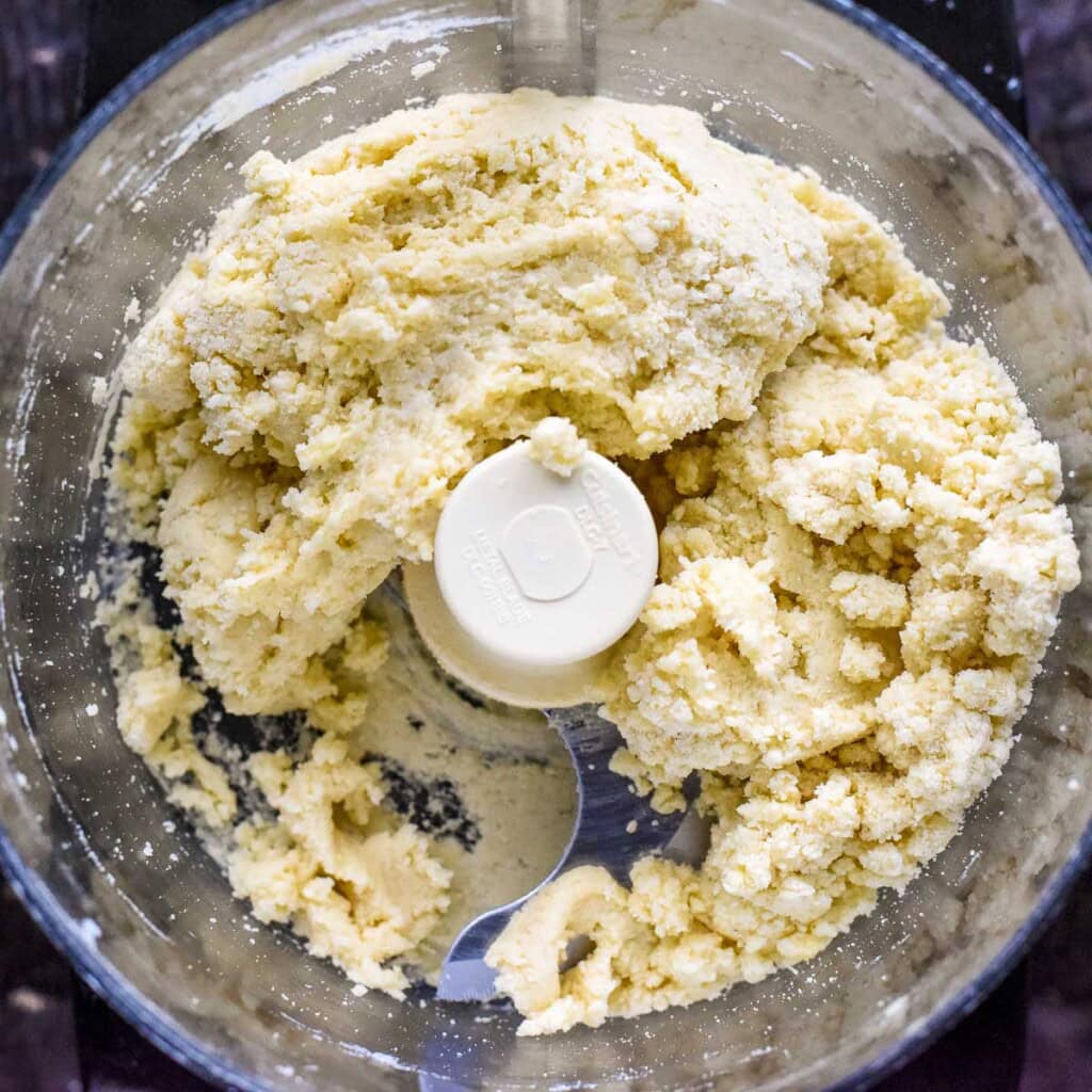 Shortcake dough coming together in food processor.