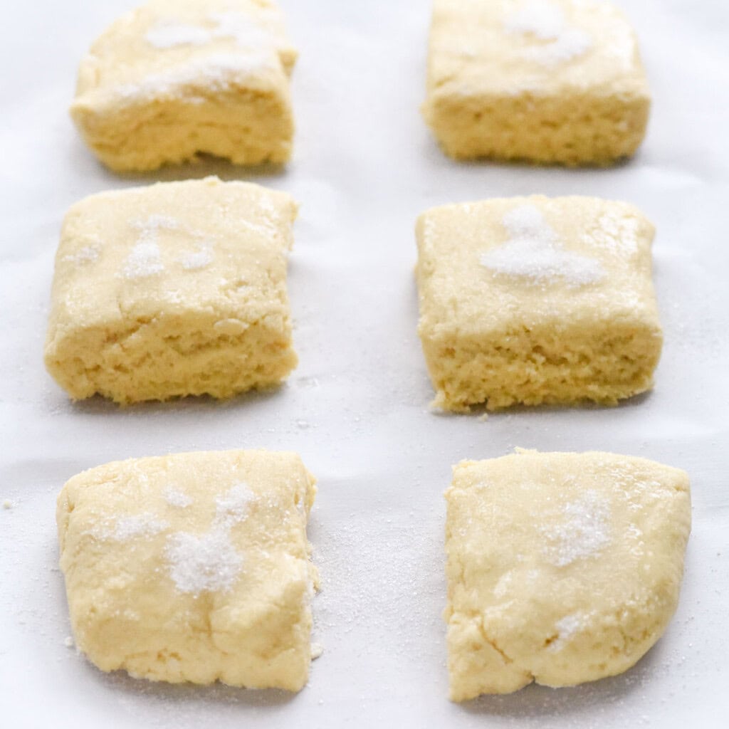 Shortcake squares sprinkled with sugar and ready for oven.