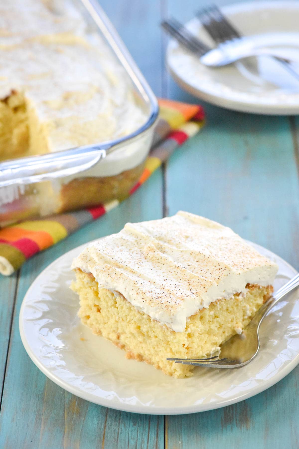 Tres Leches Cake recipe on plate and in baking dish.