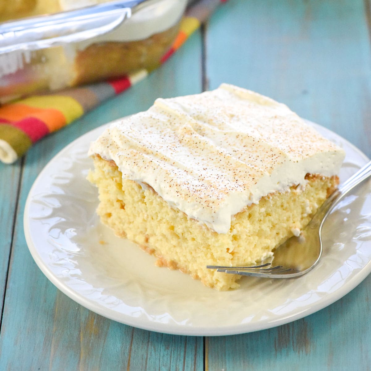 Easy Tres Leches Cake on plate with fork.