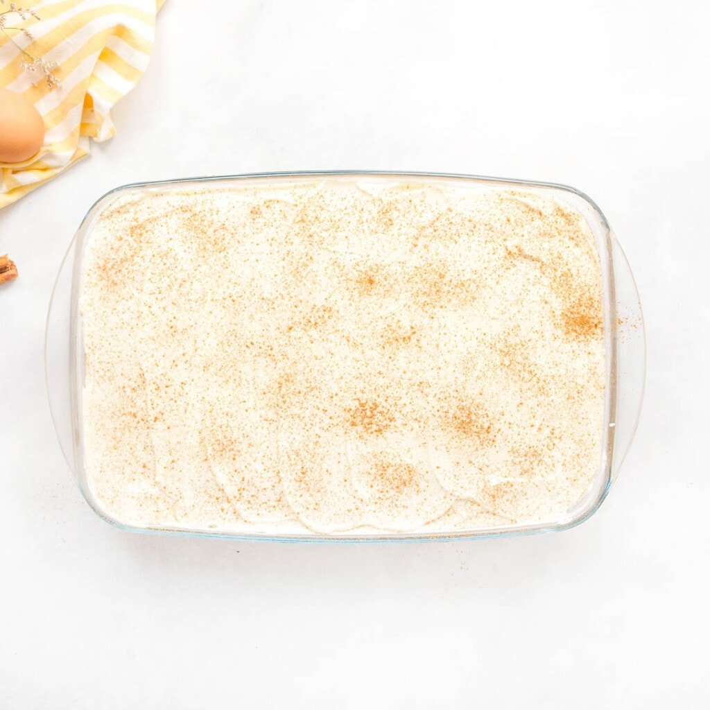 Recipe for tres leches cake sprinkled with cinnamon.