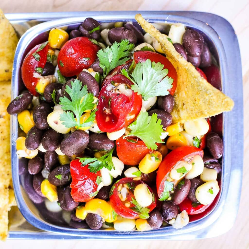 Black Bean and Corn Salad aerial view in square pewter bowl.
