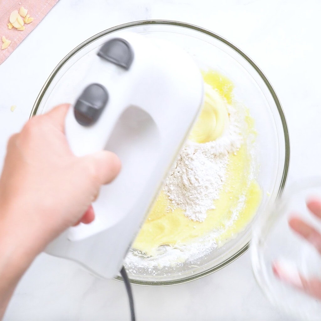 Adding more flour to batter.