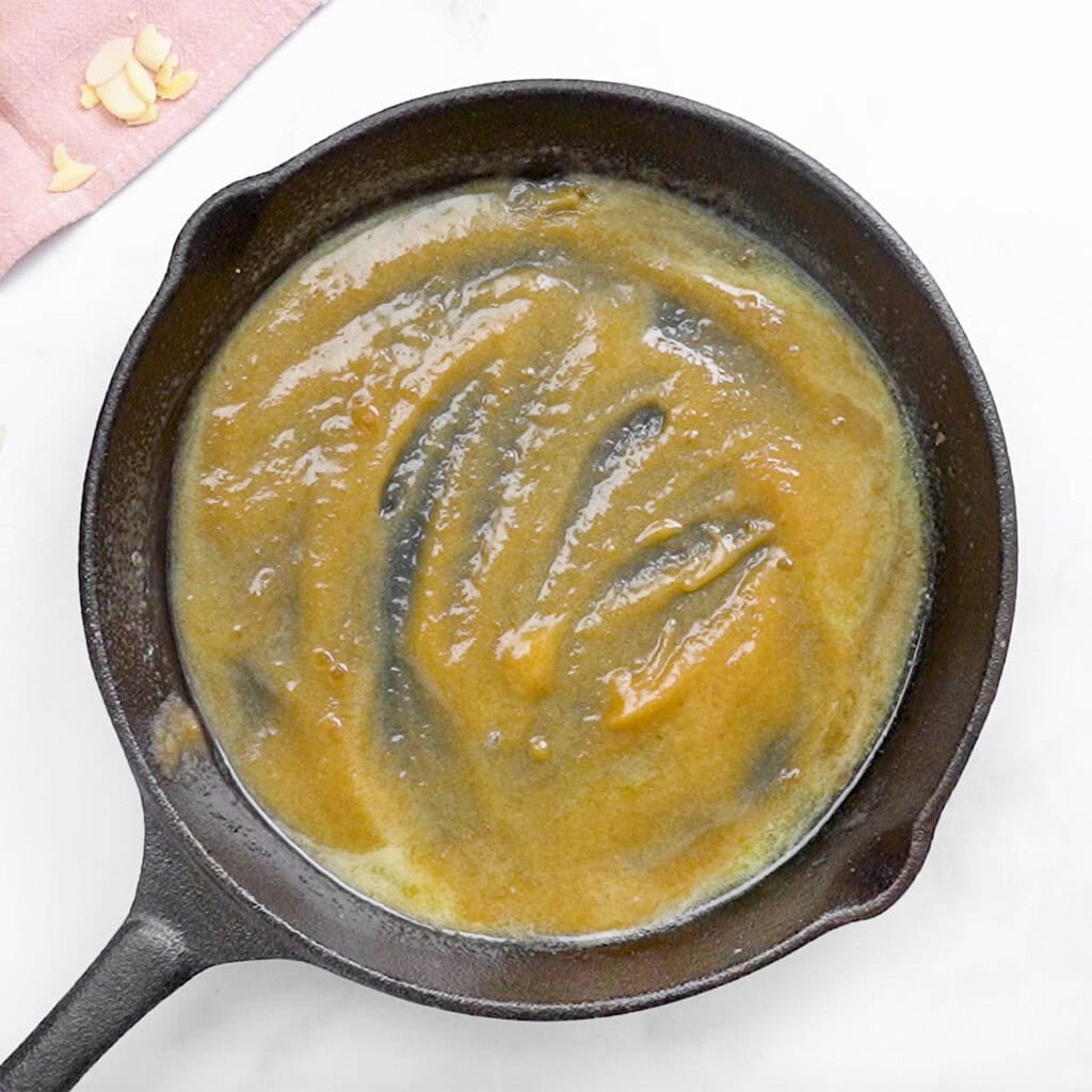 Melted butter combined with brown sugar in skillet.
