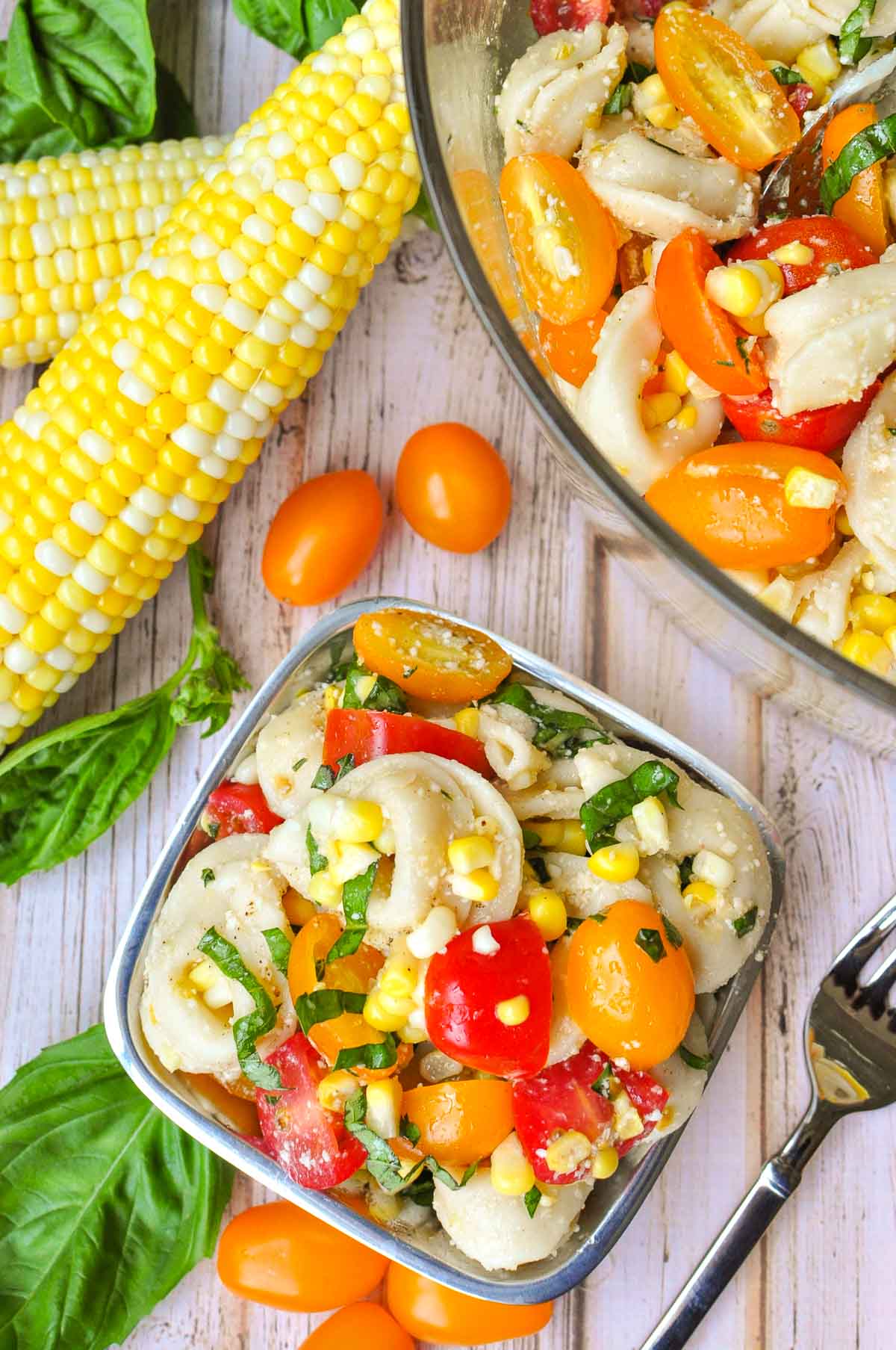 Aerial view of Tortellini Pasta Salad in serving bowl and individual bowl.