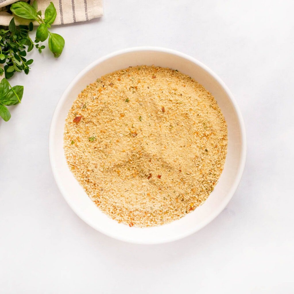 Seasoned breadcrumbs on a plate.