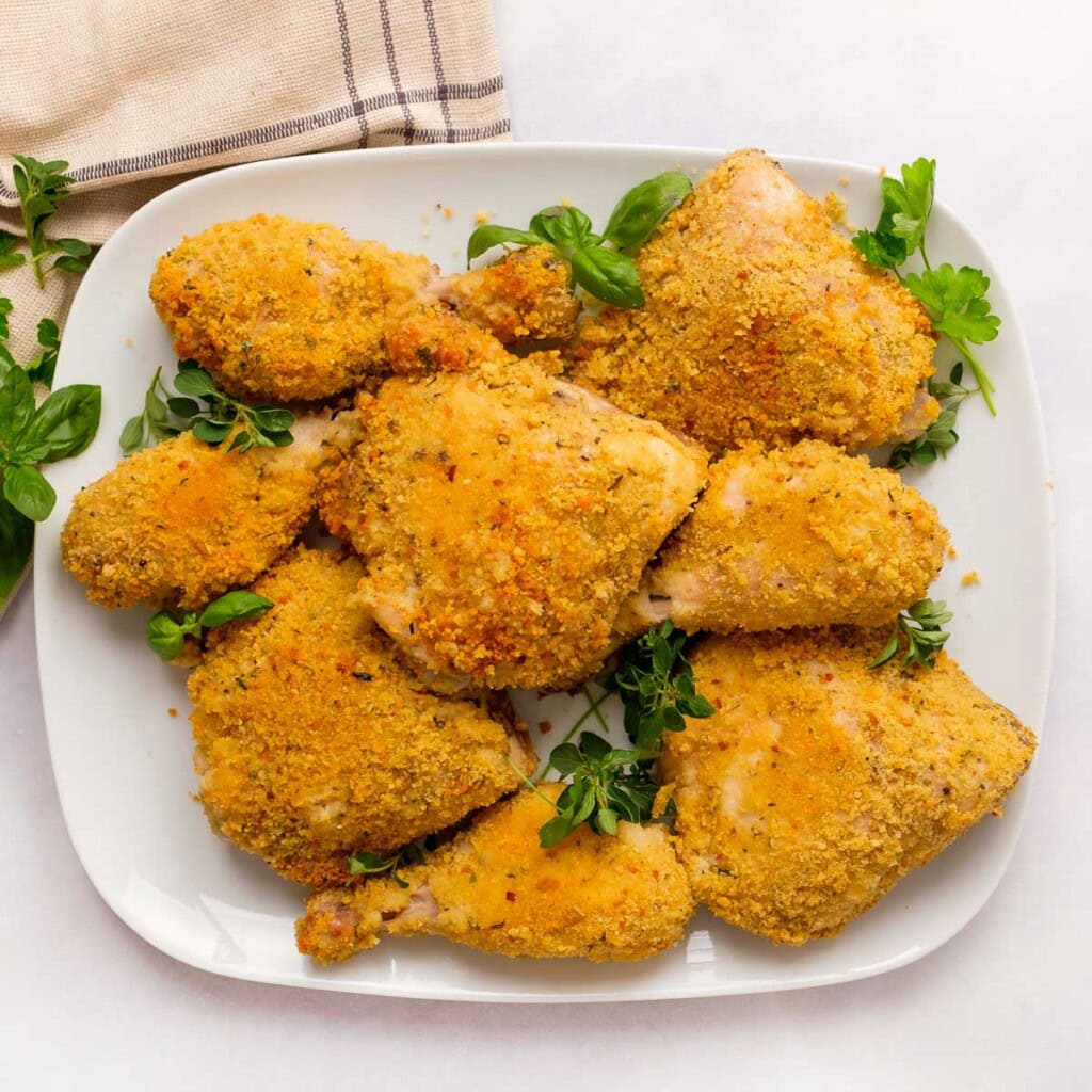 Heaping platter garnished with fresh herbs.