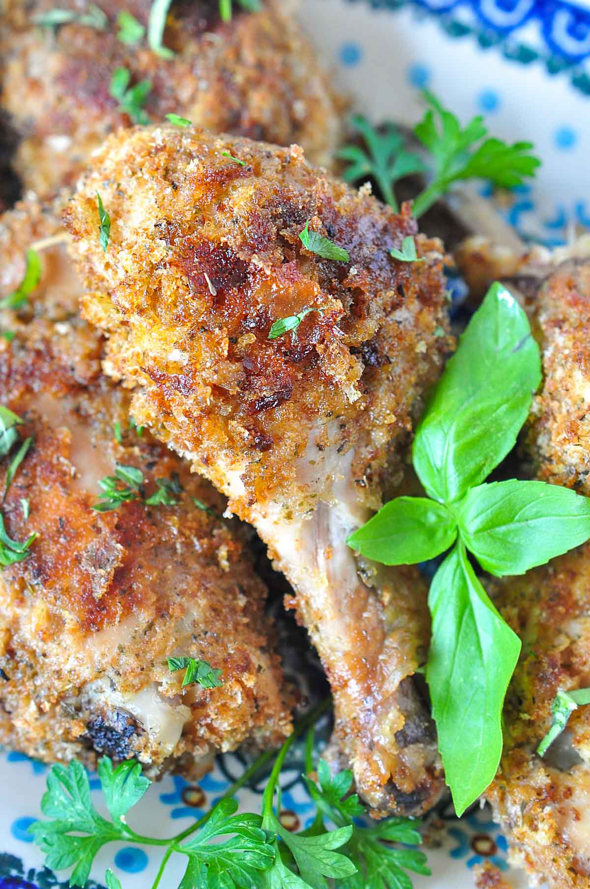 Baked Italian Chicken with basil on platter.