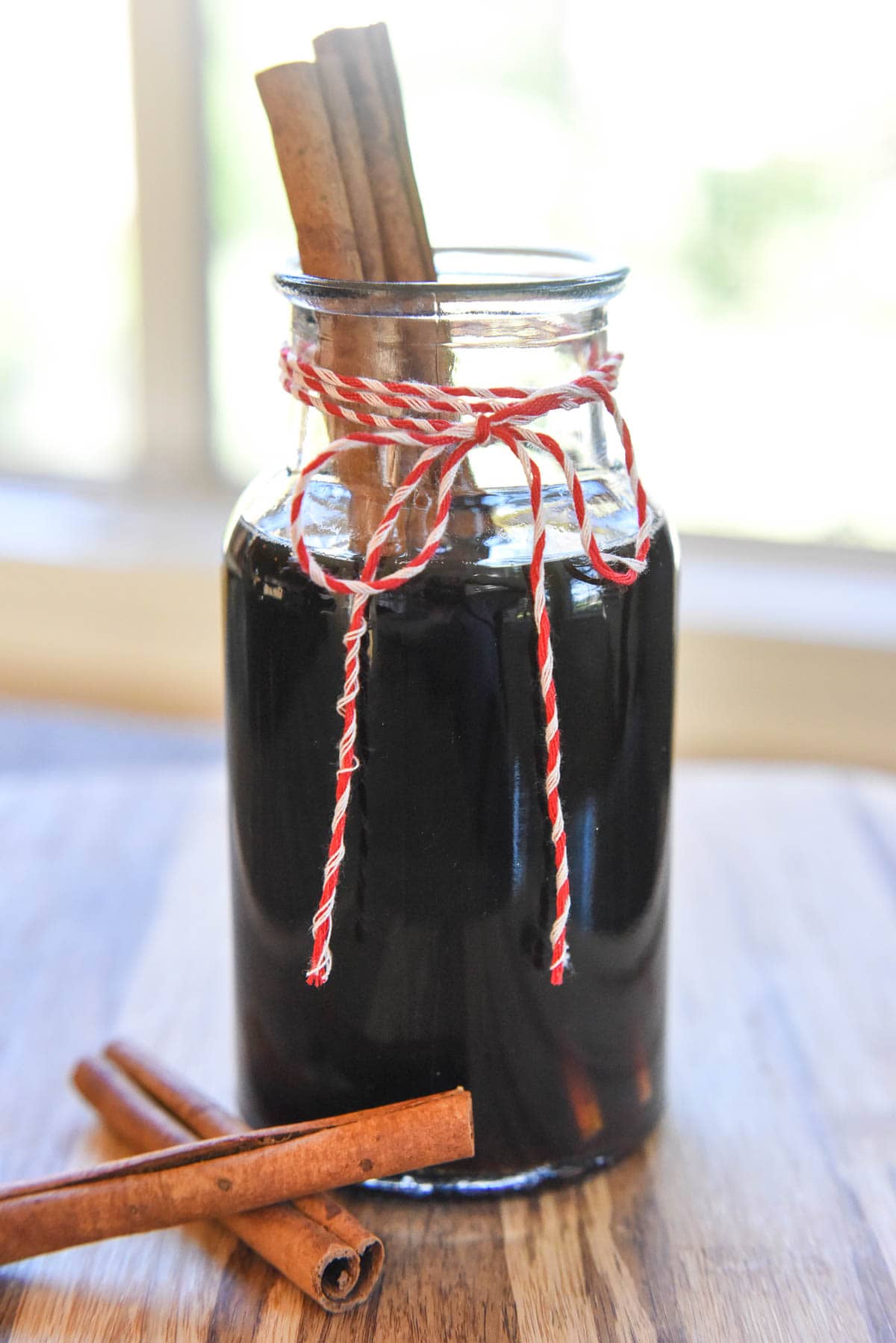 Cinnamon Dolce Syrup garnished with cinnamon sticks.