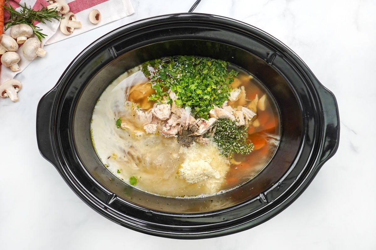 Chicken Noodle Soup Crock Pot with shredded chicken and fresh herbs.