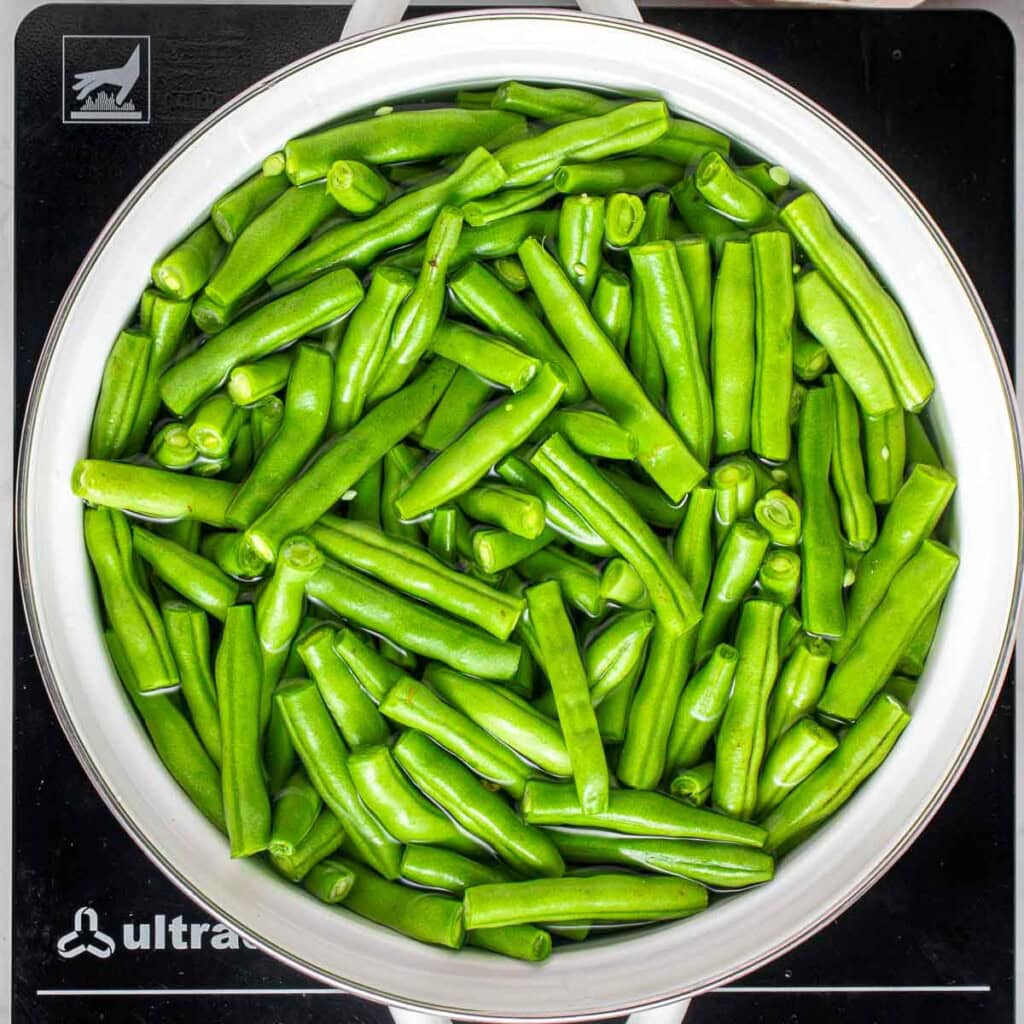 Cooking green beans for fresh green bean casserole.