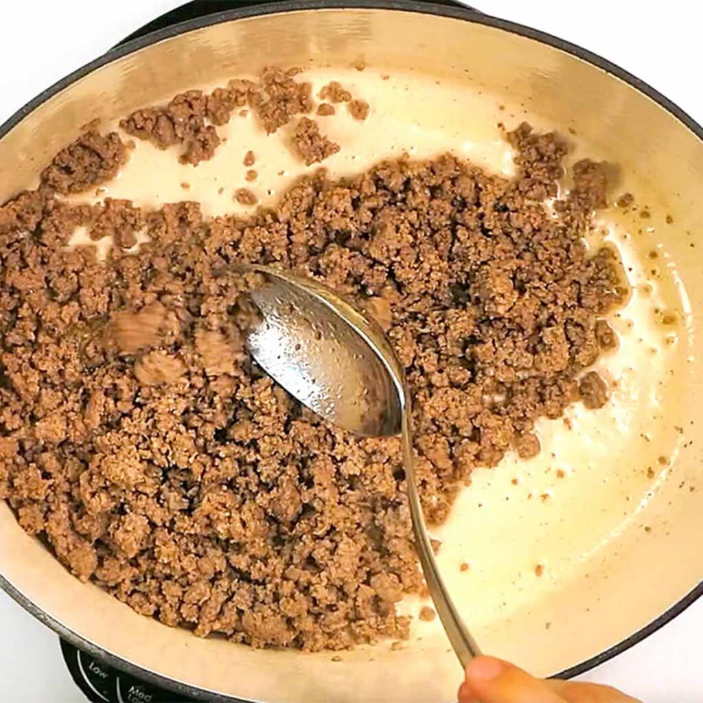 Browning ground beef in pan for healthy ground beef recipes.