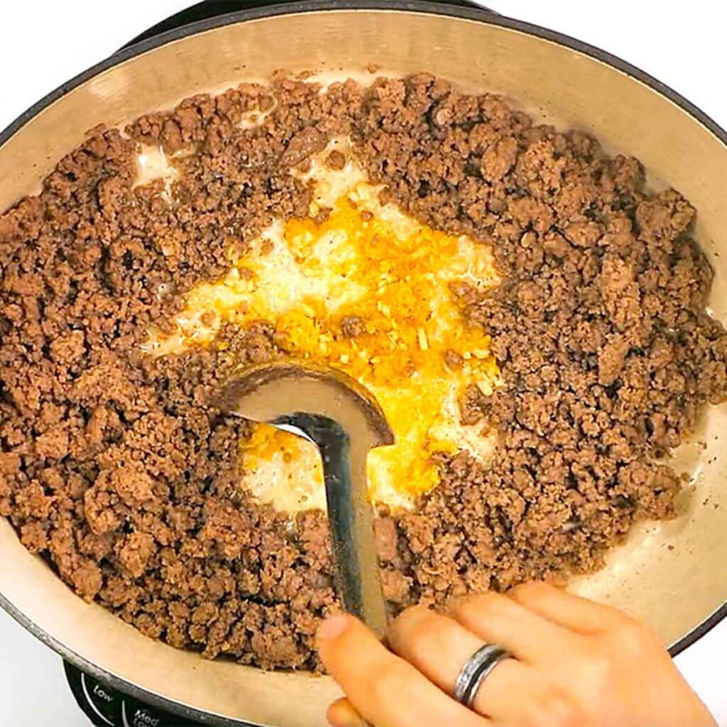 Simple ground beef recipes starting with browned hamburger meat in pan.