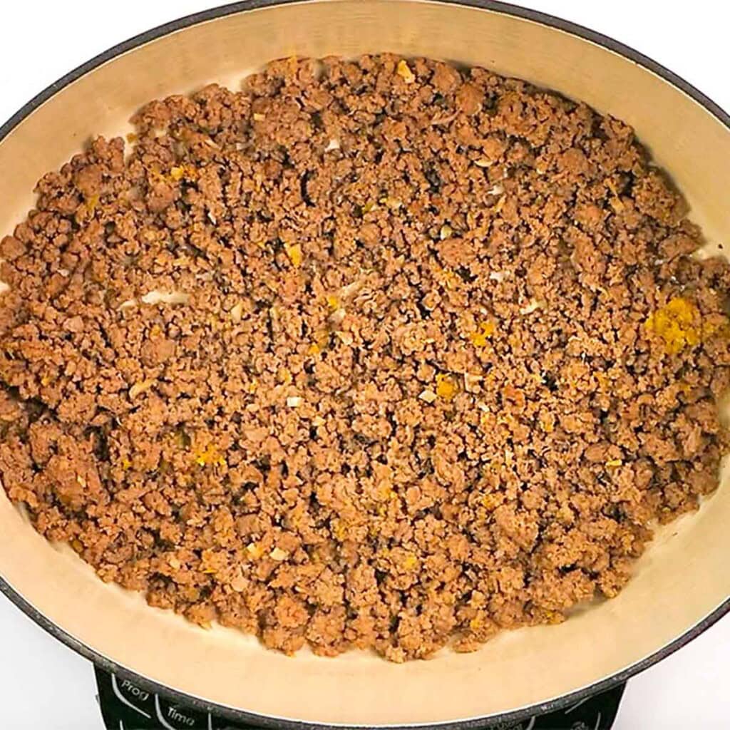 Browned ground beef in skillet for Ground Beef and Broccoli recipe.