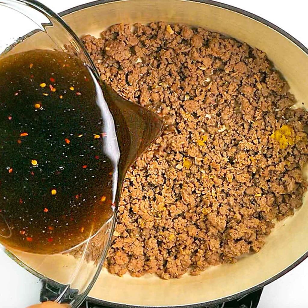 Adding sauce to recipes with ground beef.