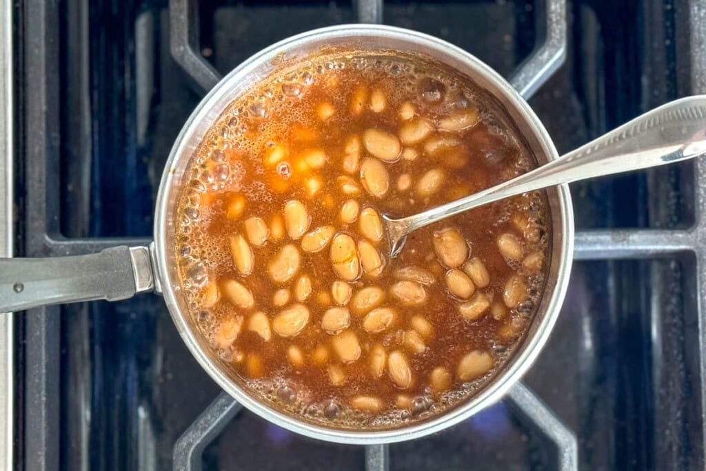 Easy Baked Beans recipe simmering on stove.