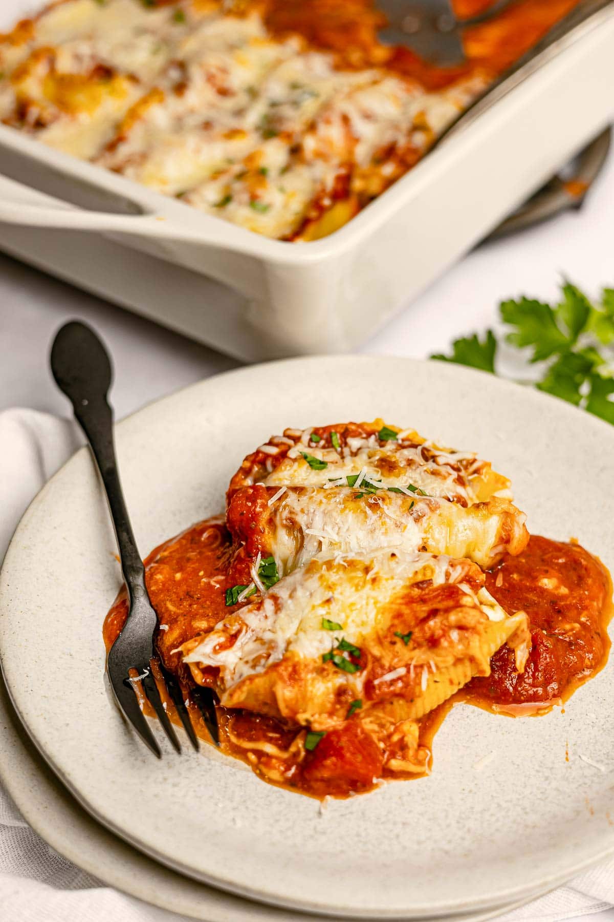 Stuffed Shells with Meat on plate with fork.