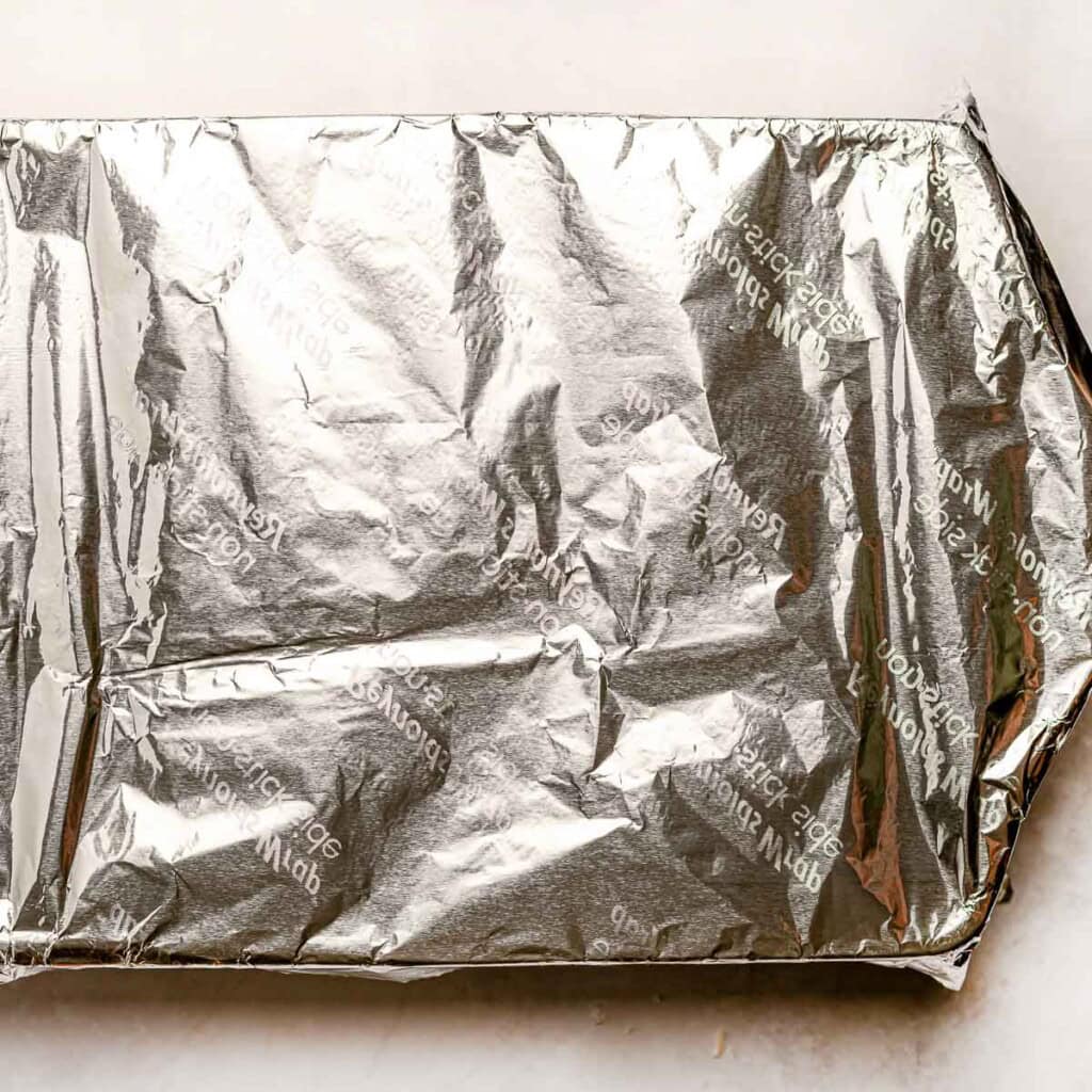 Dish covered with foil and ready for oven.