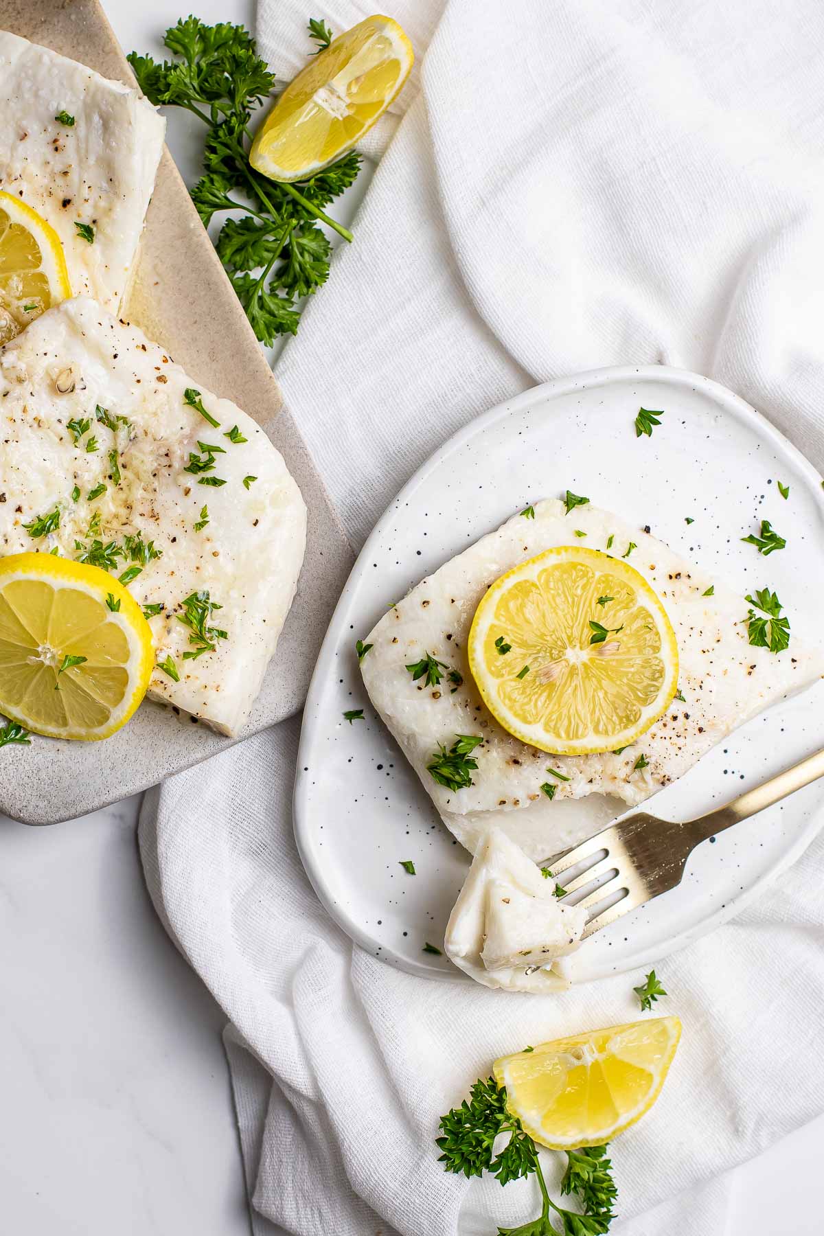 Baked Halibut on serving platter and plate.