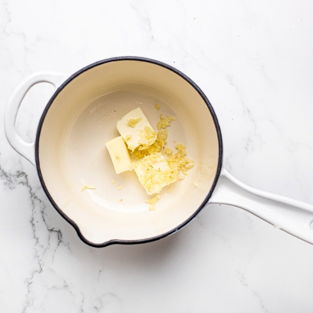 Butter and garlic in saucepan.