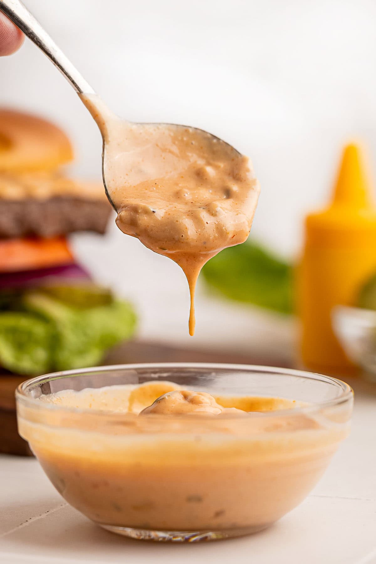 Best Burger Sauce dripping off of spoon.