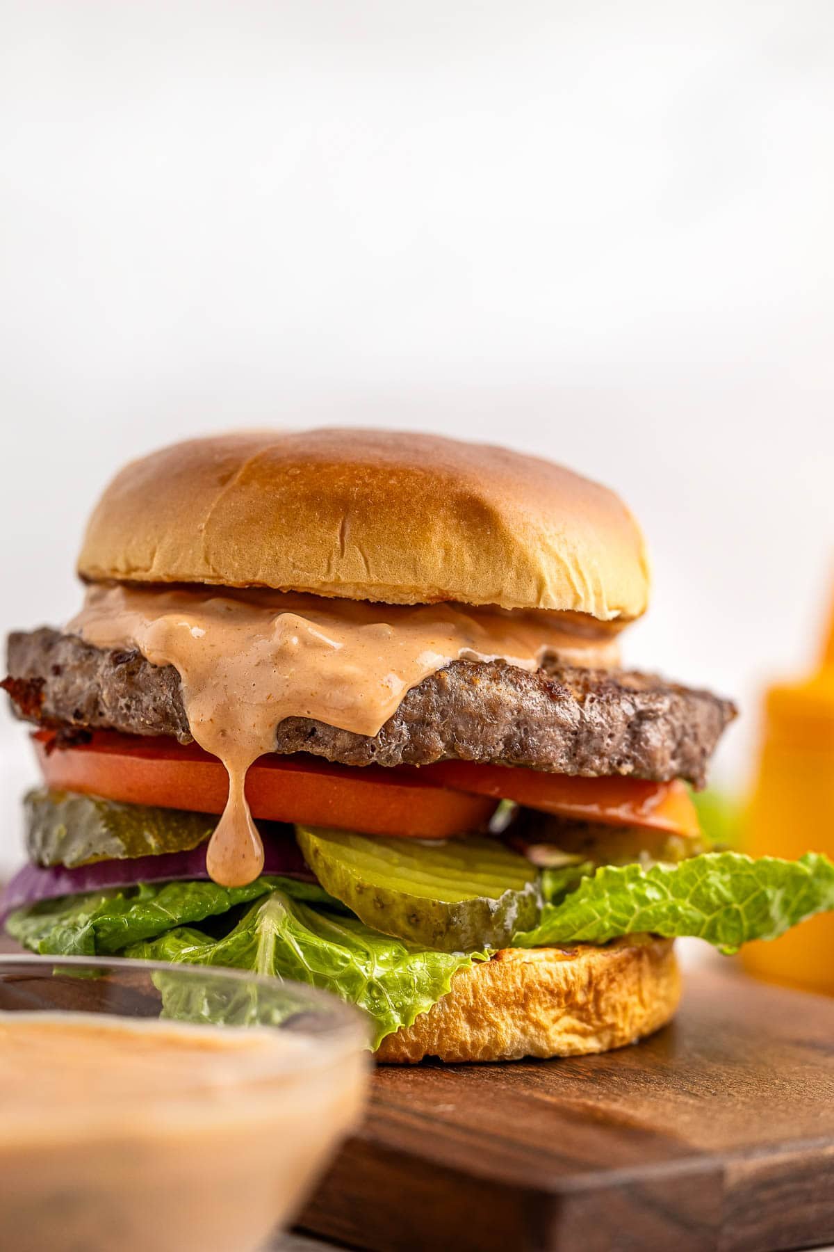 Burger Sauce recipe dripping down side of burger.