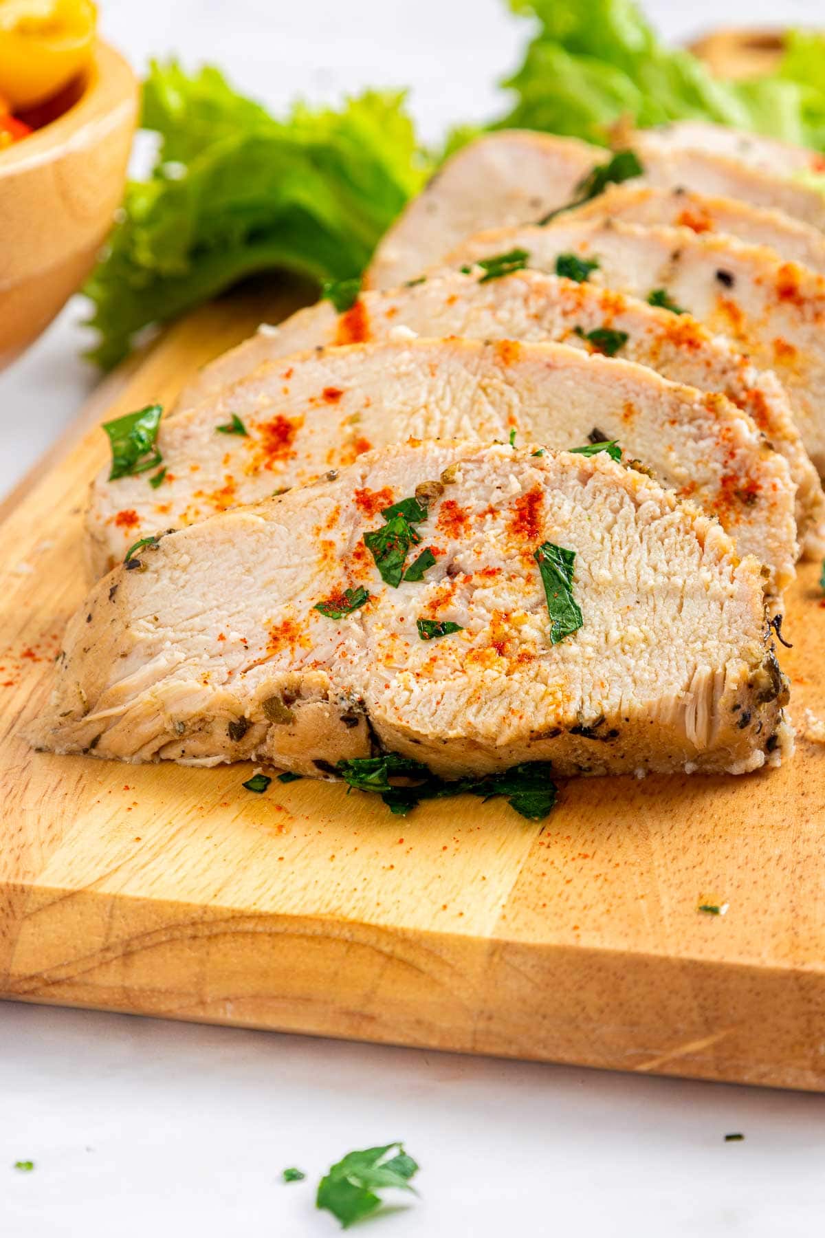 Mediterranean Chicken Marinade close-up slices of chicken.