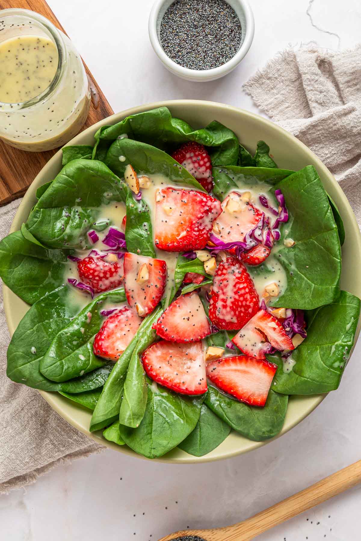 Poppy Seed Dressing aerial view on strawberry spinach salad.