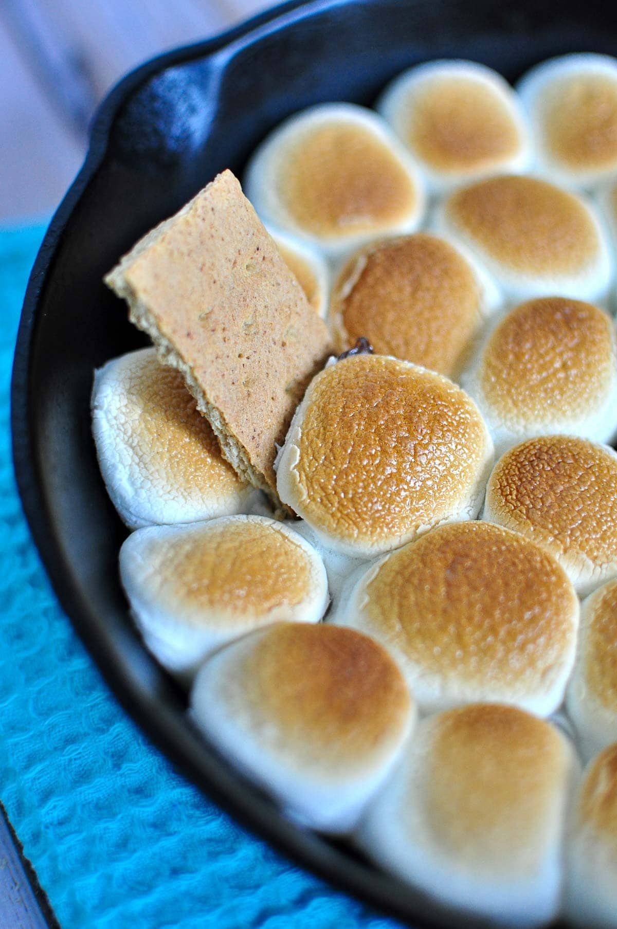 Smores Dip with graham cracker sticking out.