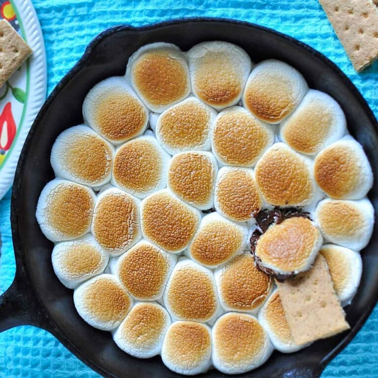 S'mores Dip in skillet with graham cracker aerial view.