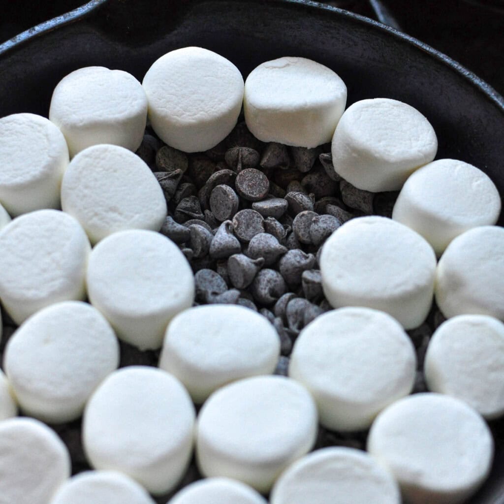 Chocolate chips and marshmallows in skillet.