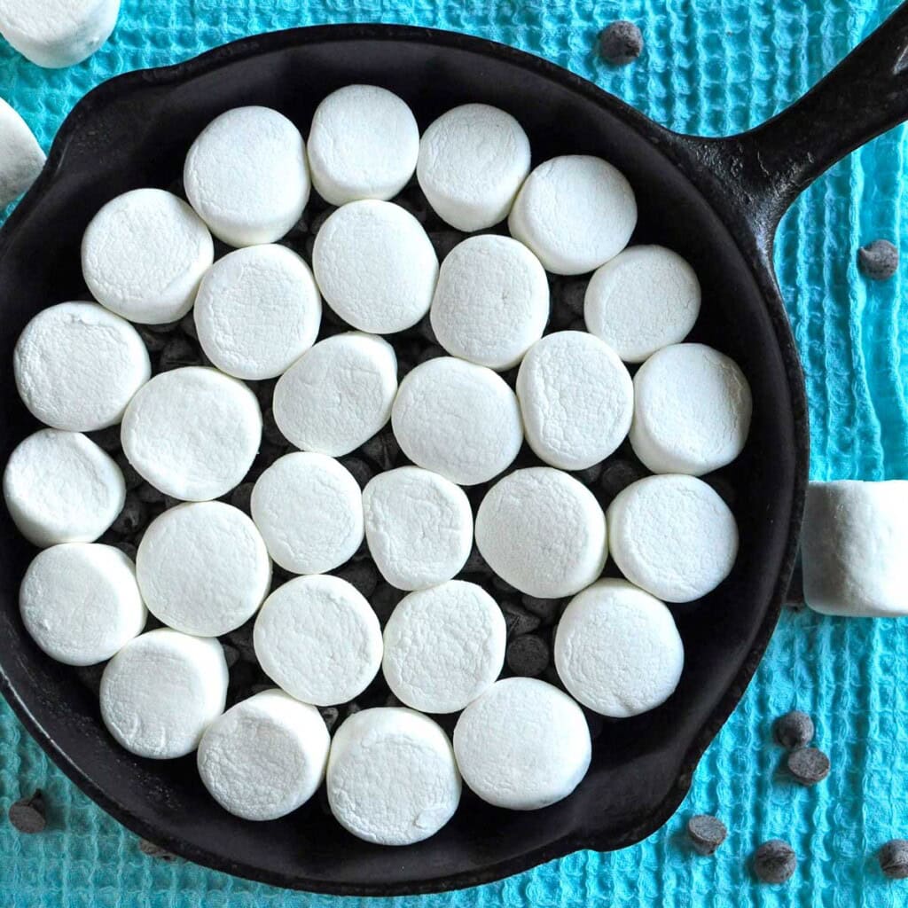 Cast iron skillet of smores dip ready for oven.