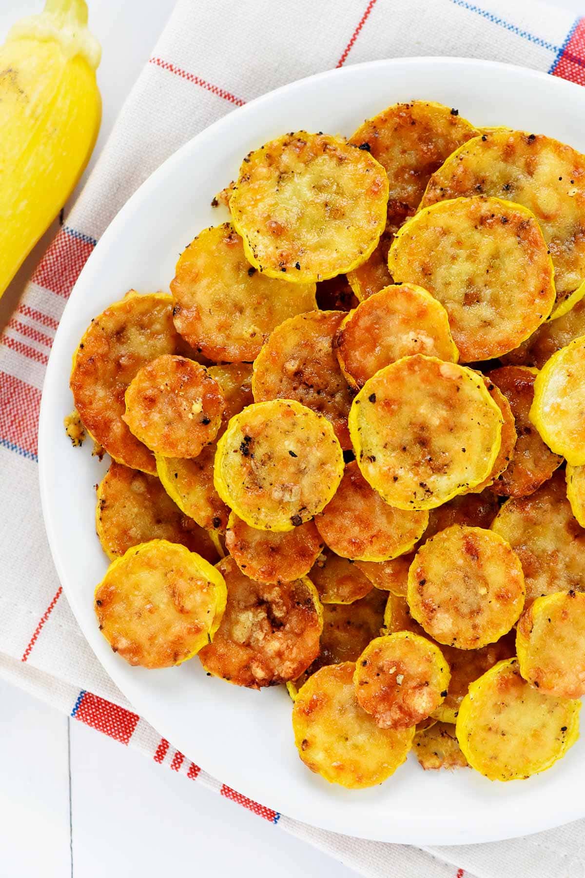 Baked yellow squash recipe aerial view on plate.