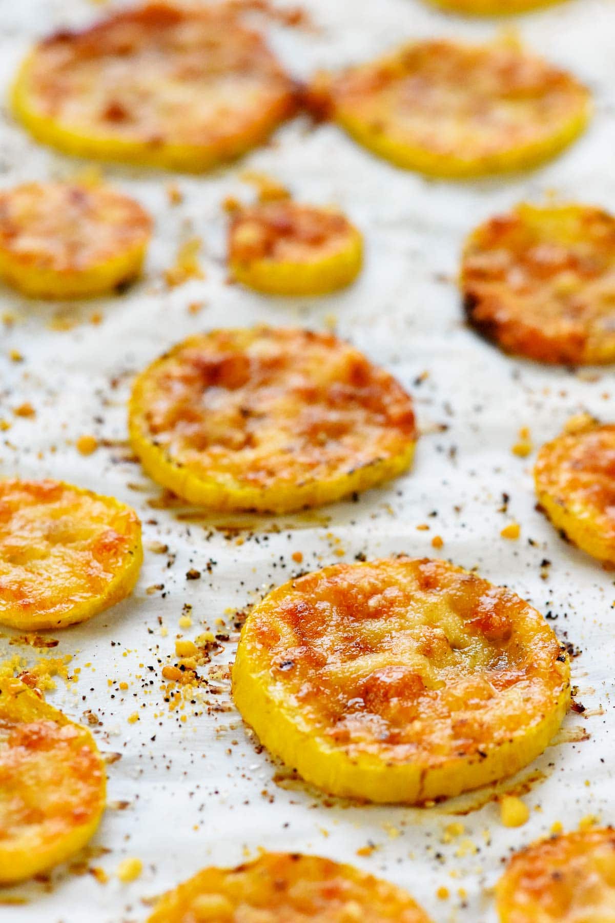 Baked yellow squash on pan close-up.